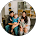A blurry picture of a family sitting on a couch.