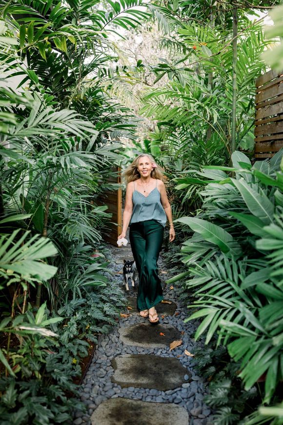 family law coach annabel walks through her kailua home surrounded by greenery