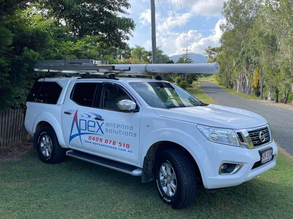 White Nissan Pickup Truck With Roof Rack— Apex Antenna Solutions Pty Ltd in Whitsundays, QLD