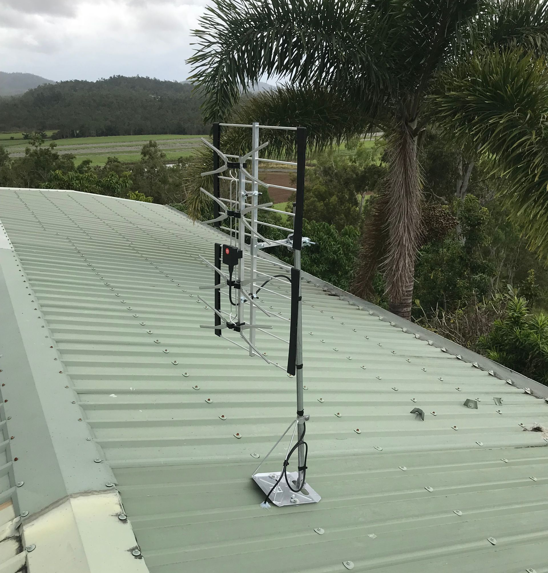 Tv Antenna Under a Cloudy Sky — Apex Antenna Solutions Pty Ltd in Whitsundays, QLD