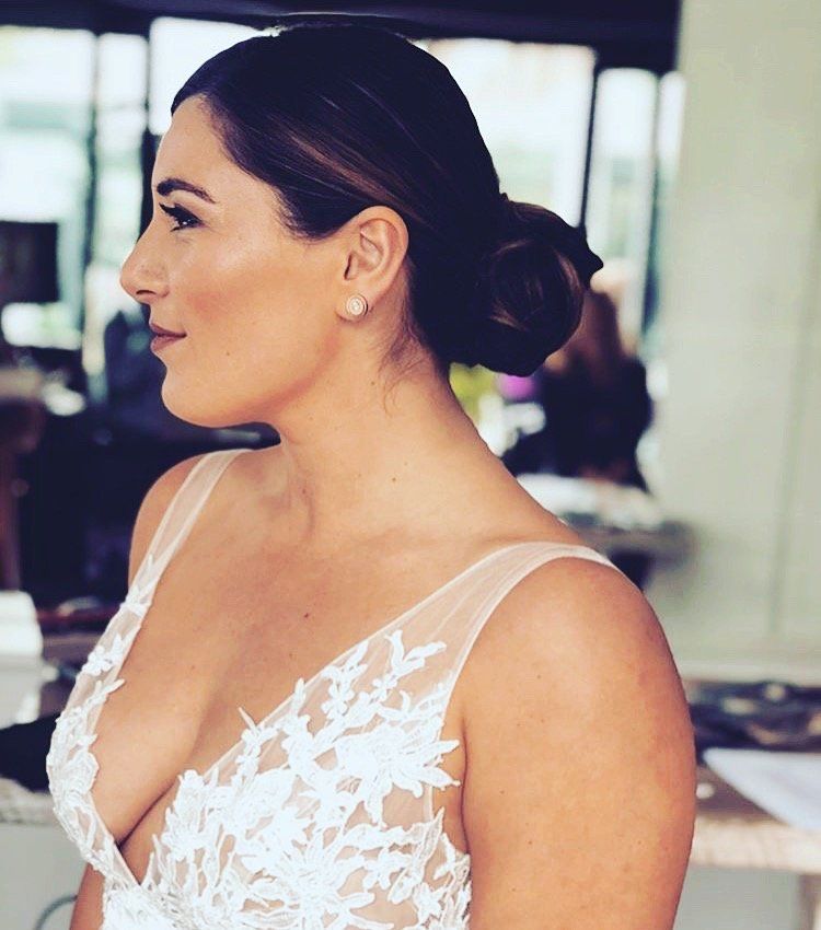 A woman in a white dress with a plunging neckline