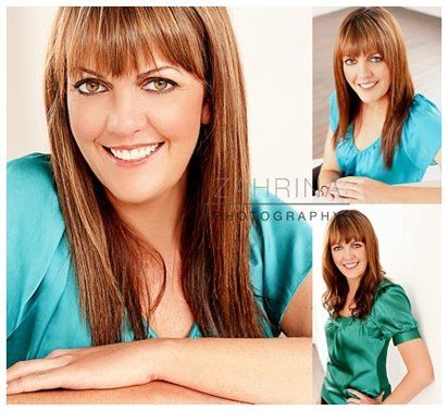 A woman in a green shirt is smiling for the camera