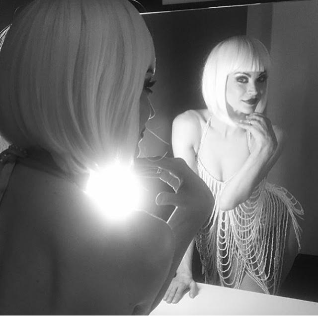 A woman taking a picture of herself in a mirror