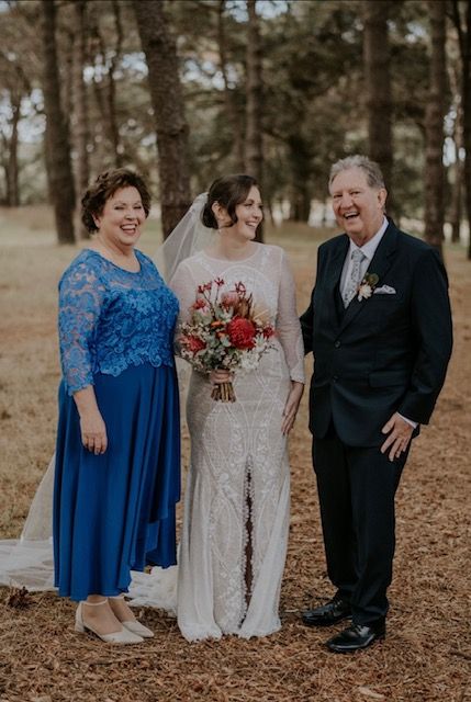 mother of the bride with bride and groom with hair and makeup by Juliet
