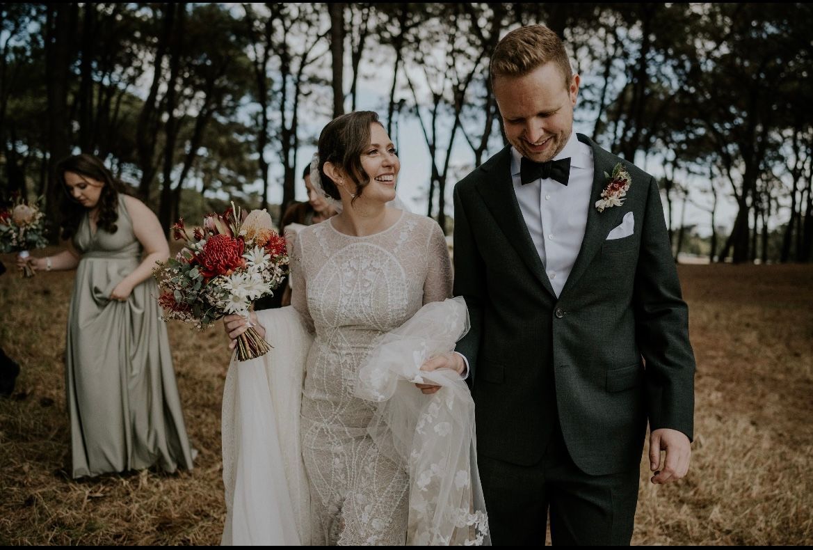 stunning bride with hair and makeup and groom