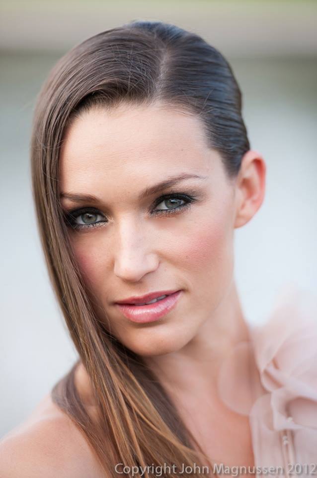 A close up of a woman 's face with the year 2012 on the bottom