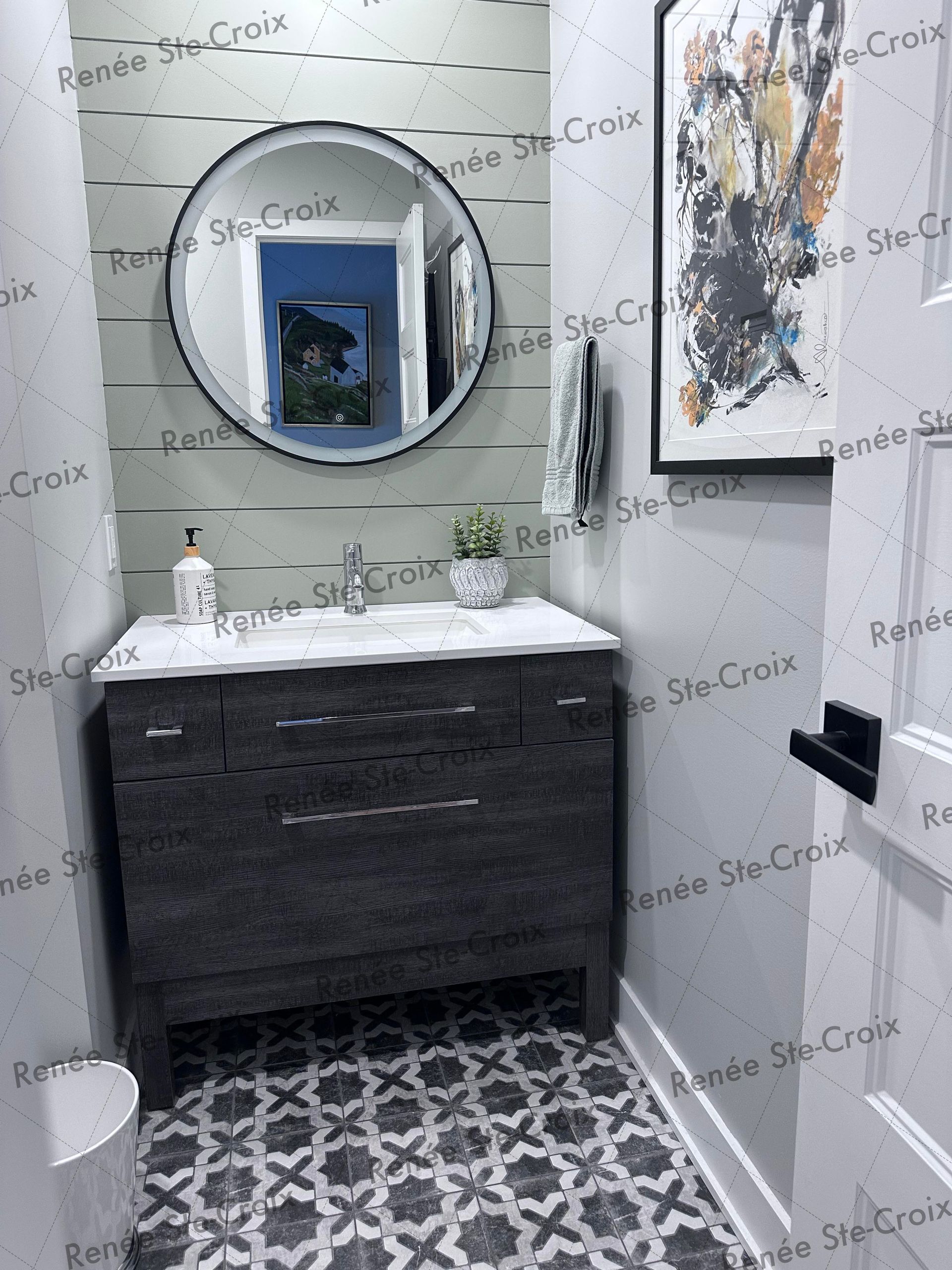 A bathroom with a sink , mirror and toilet.