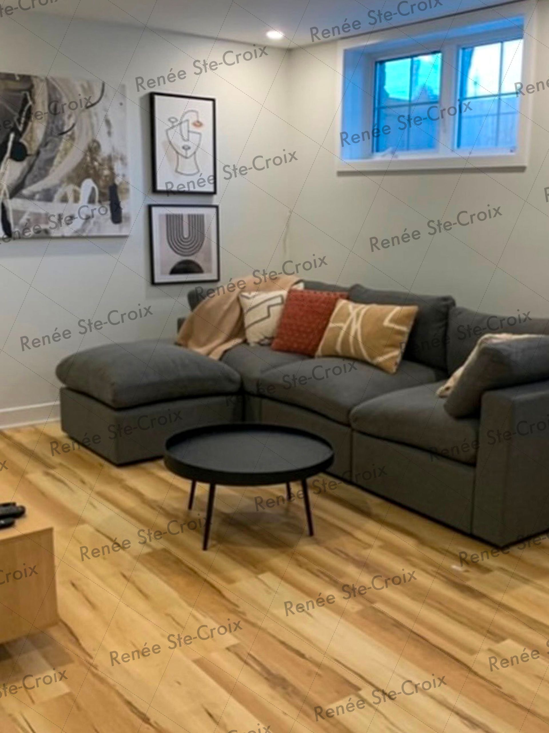 A living room with a couch and a coffee table