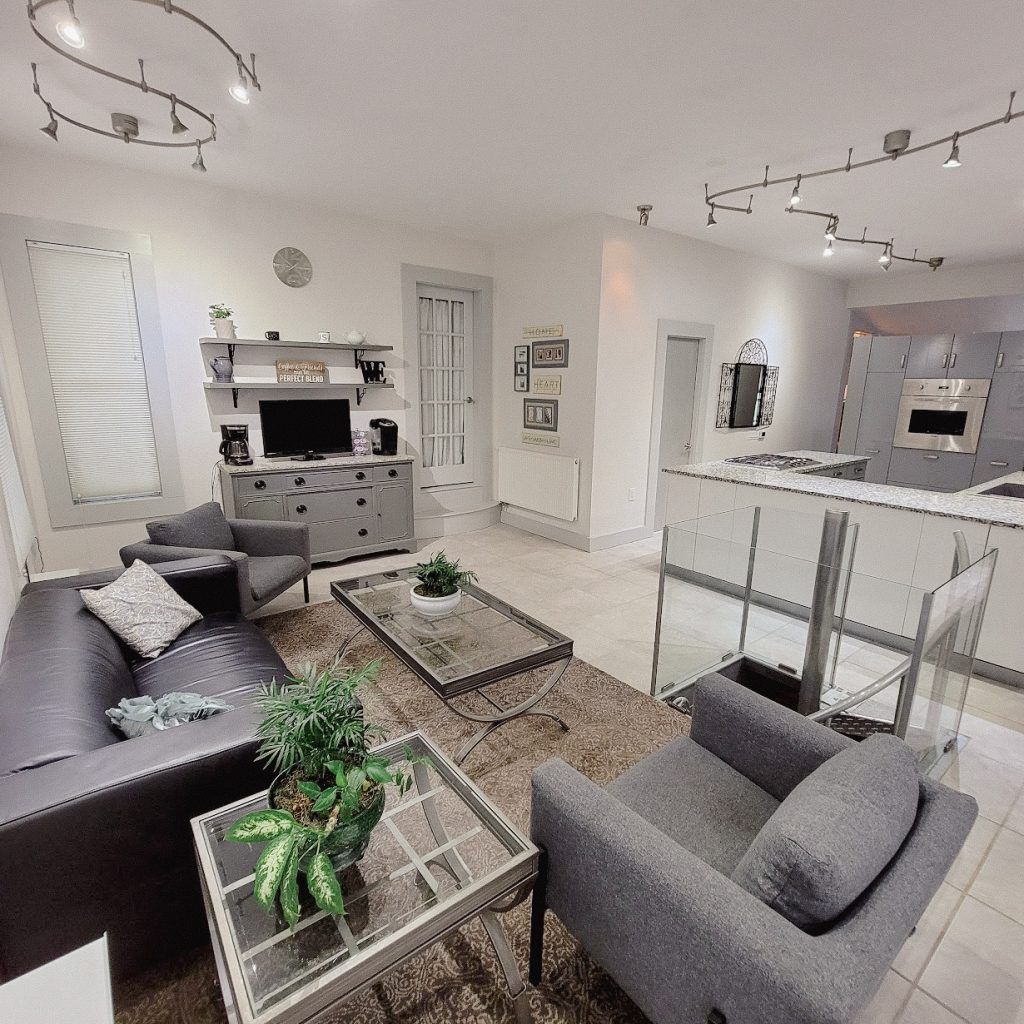 A living room with a couch a chair and a coffee table