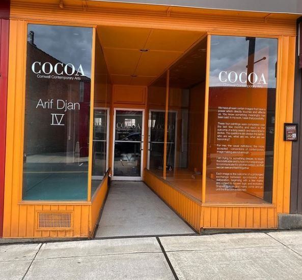 An orange building with a sign that says cocoa on it