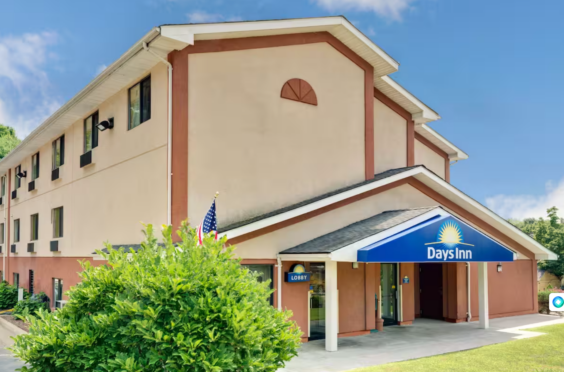 A large building with a blue sign that says days inn