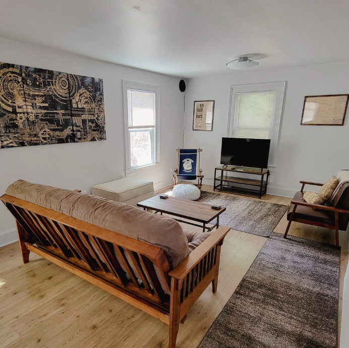 A living room with a couch and a television