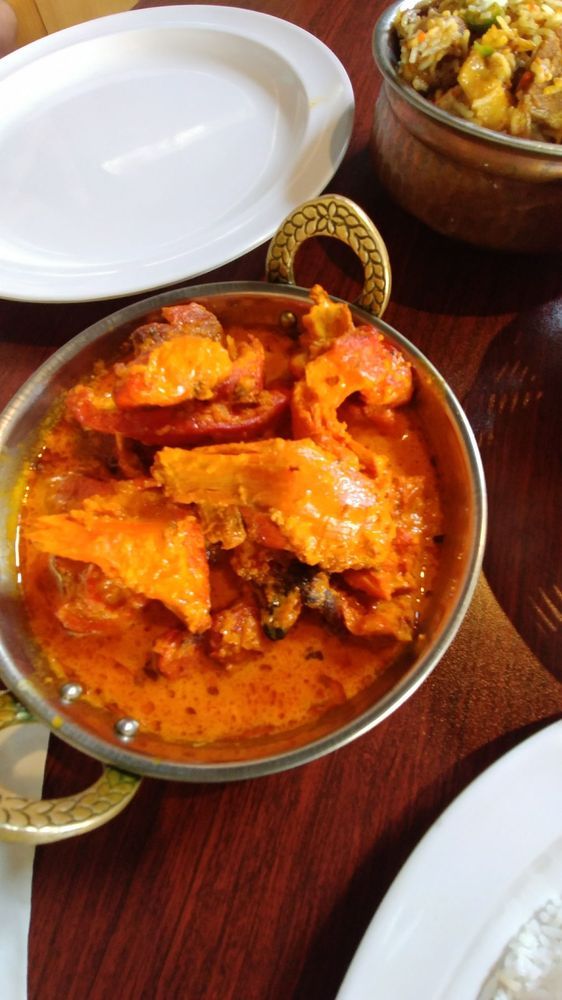 A close up of a bowl of food on a table.
