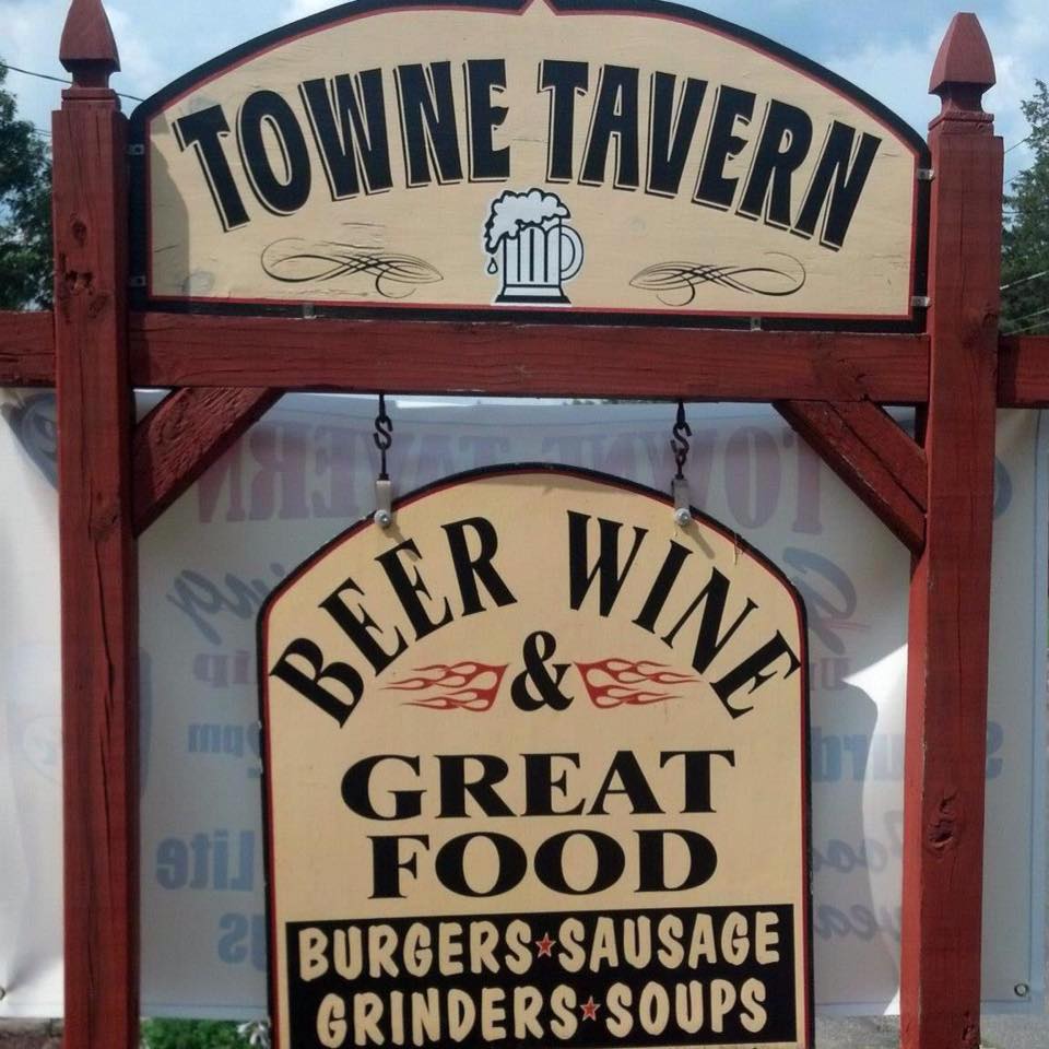 A sign for the towne tavern advertises beer wine and great food