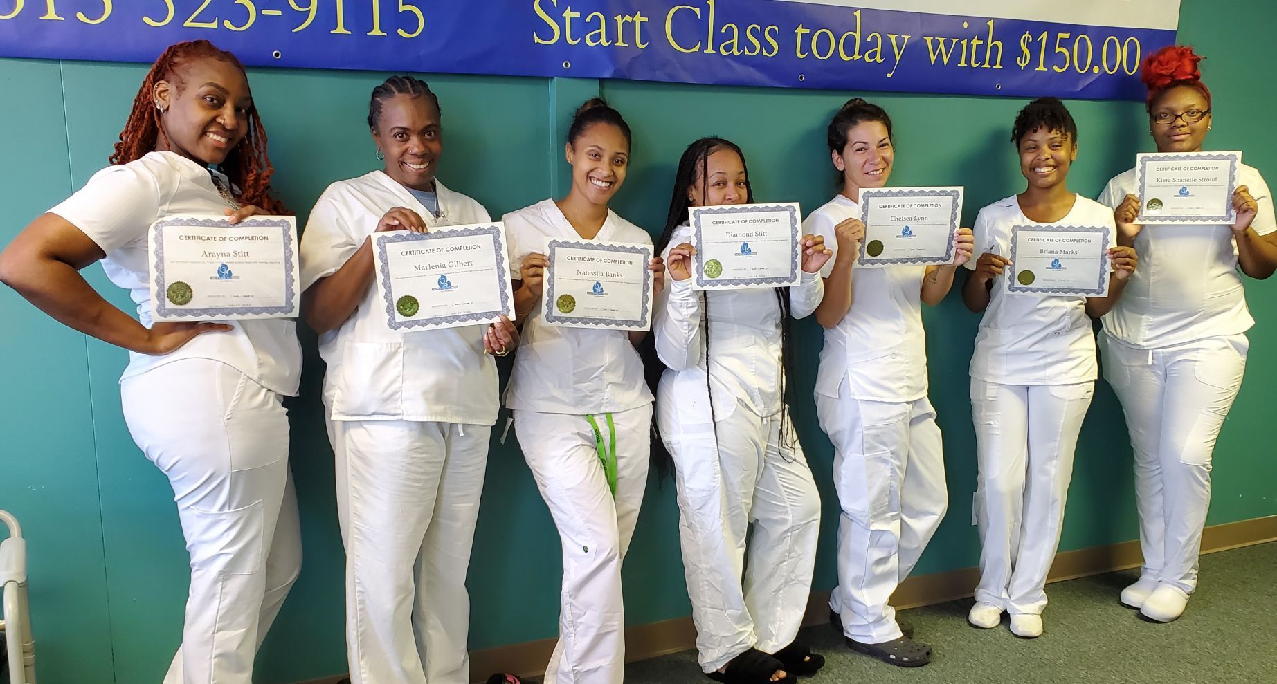 Nursing Assistant Students Holding Their Certificate