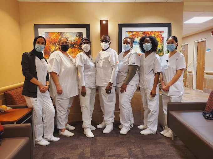 Group of Nurses Wearing Masks Are Posing for a Picture
