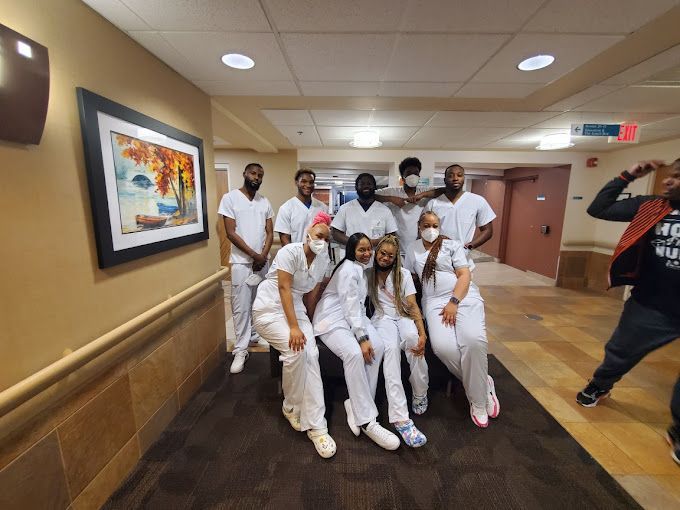 Group of Nurses Are Posing for a Picture in a Hallway