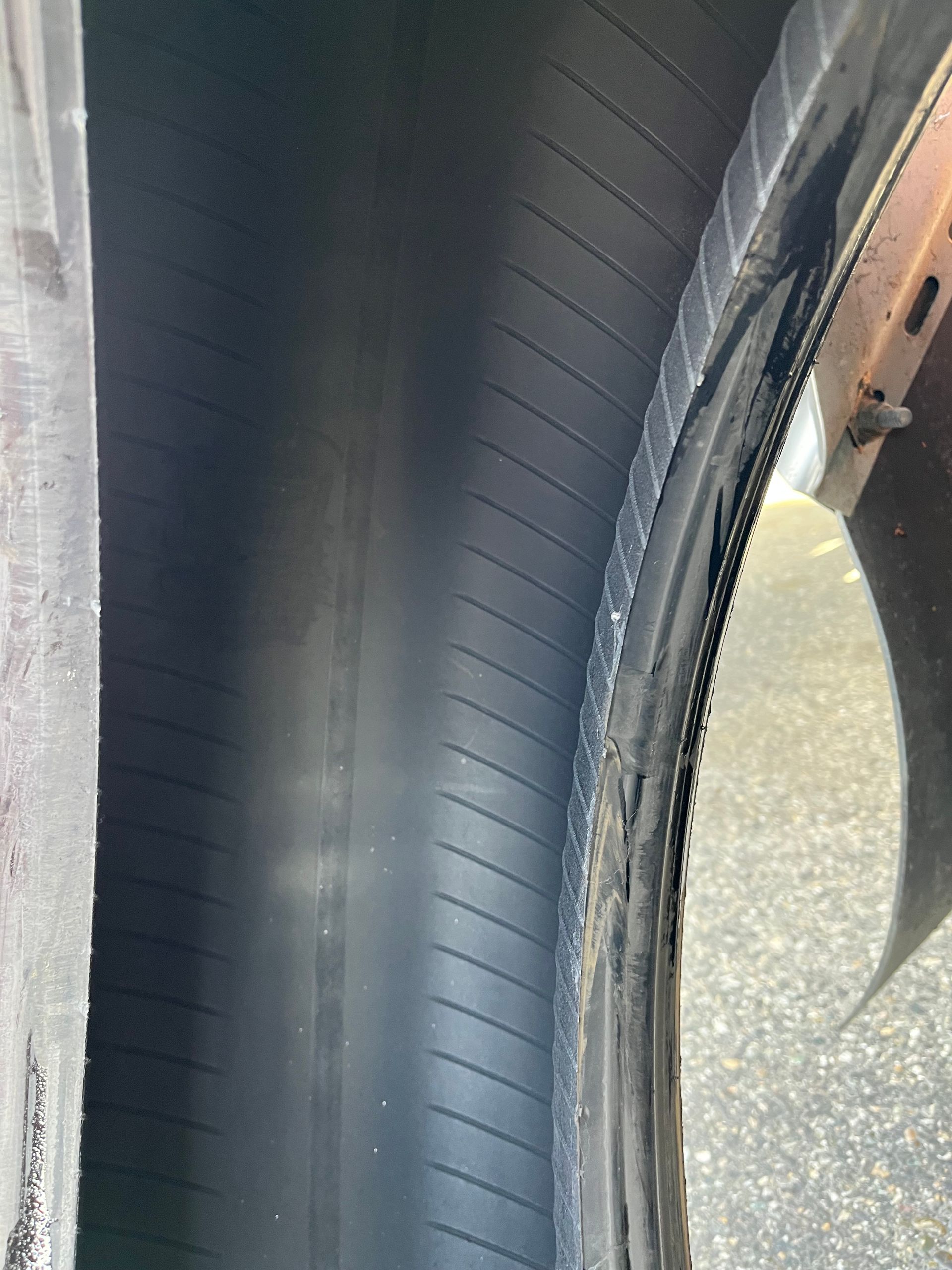 A close up of the inside of a tire on a car.