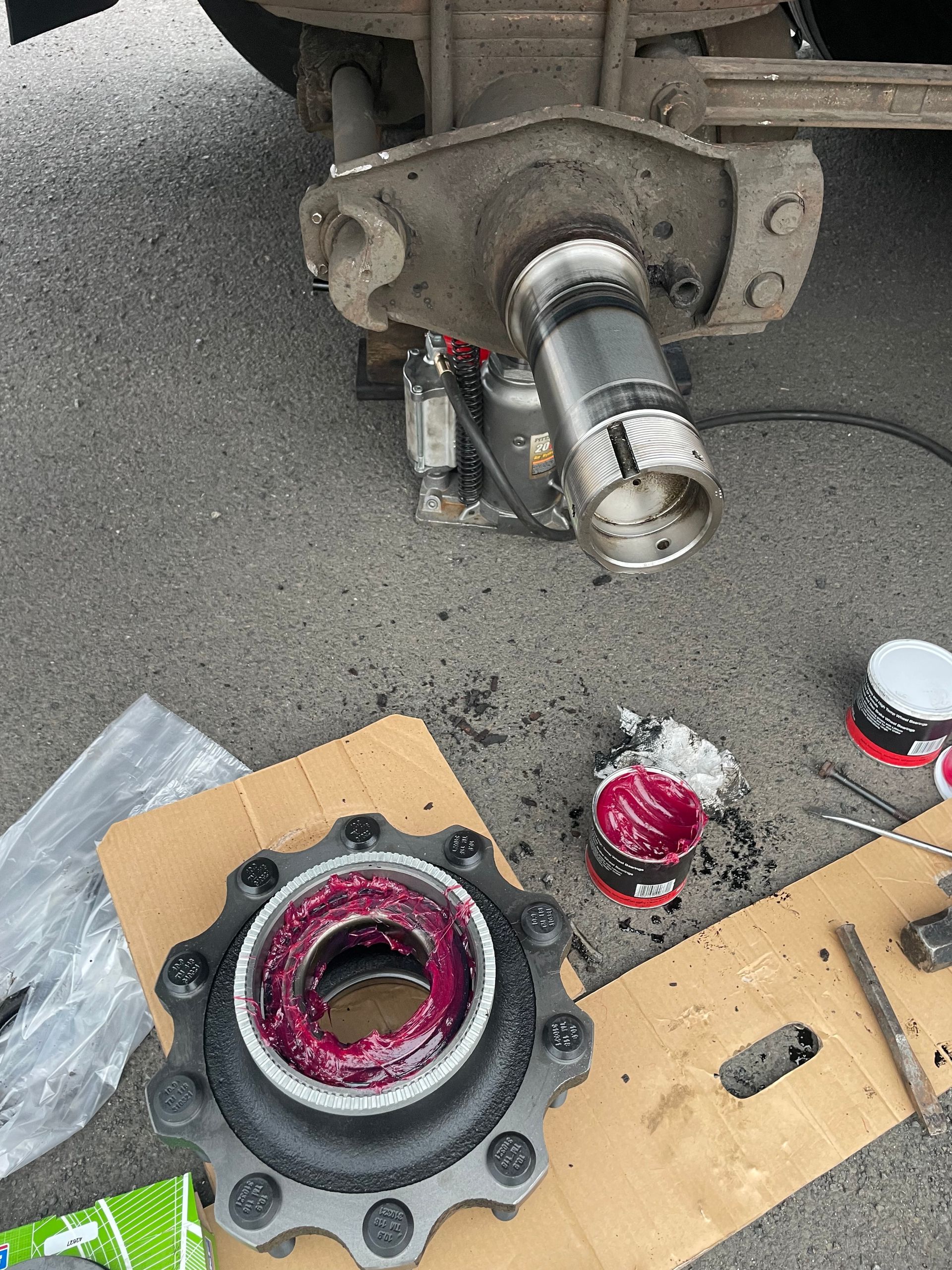 A close up of a wheel bearing on a cardboard box.