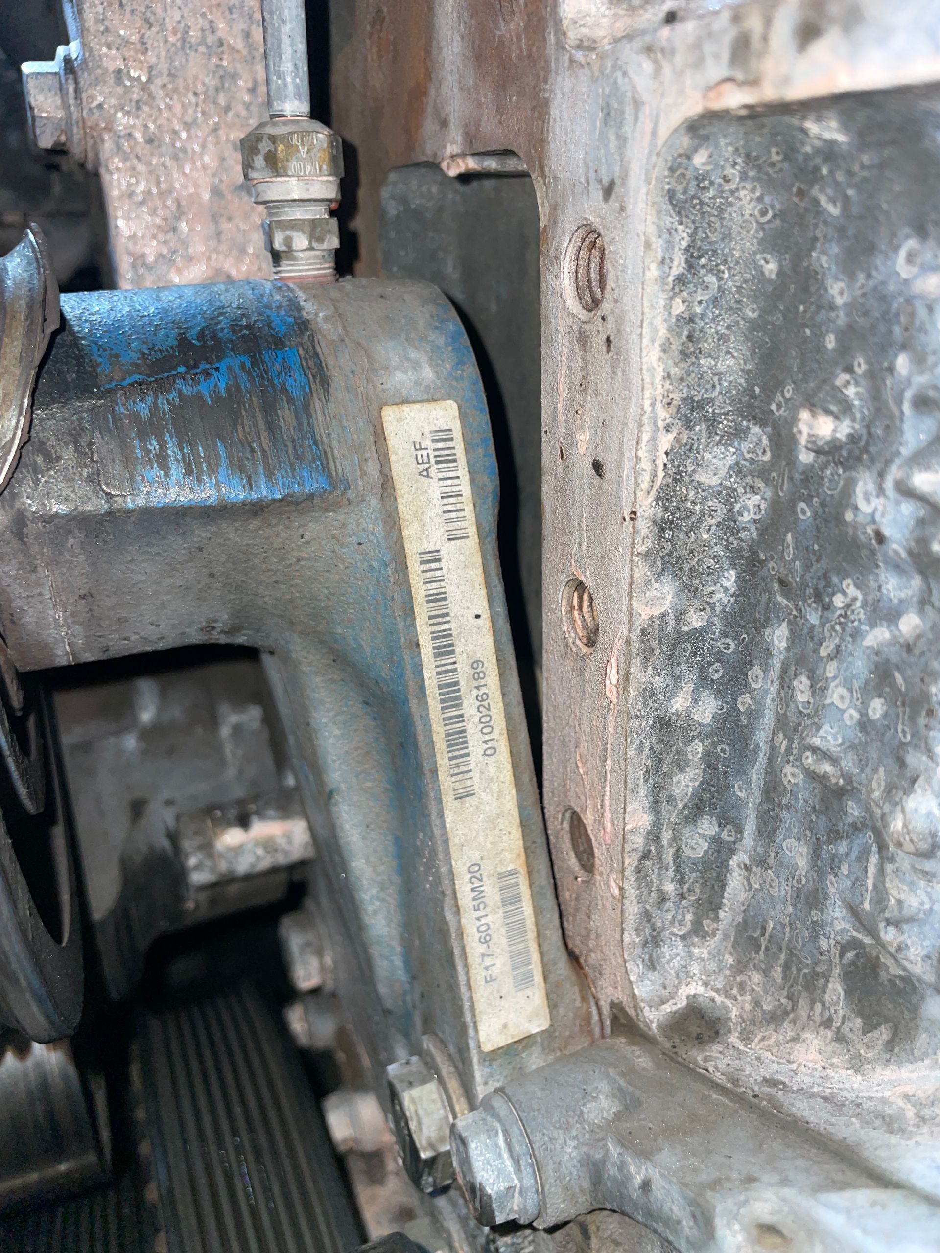 A close up of a piece of metal with a label on it.