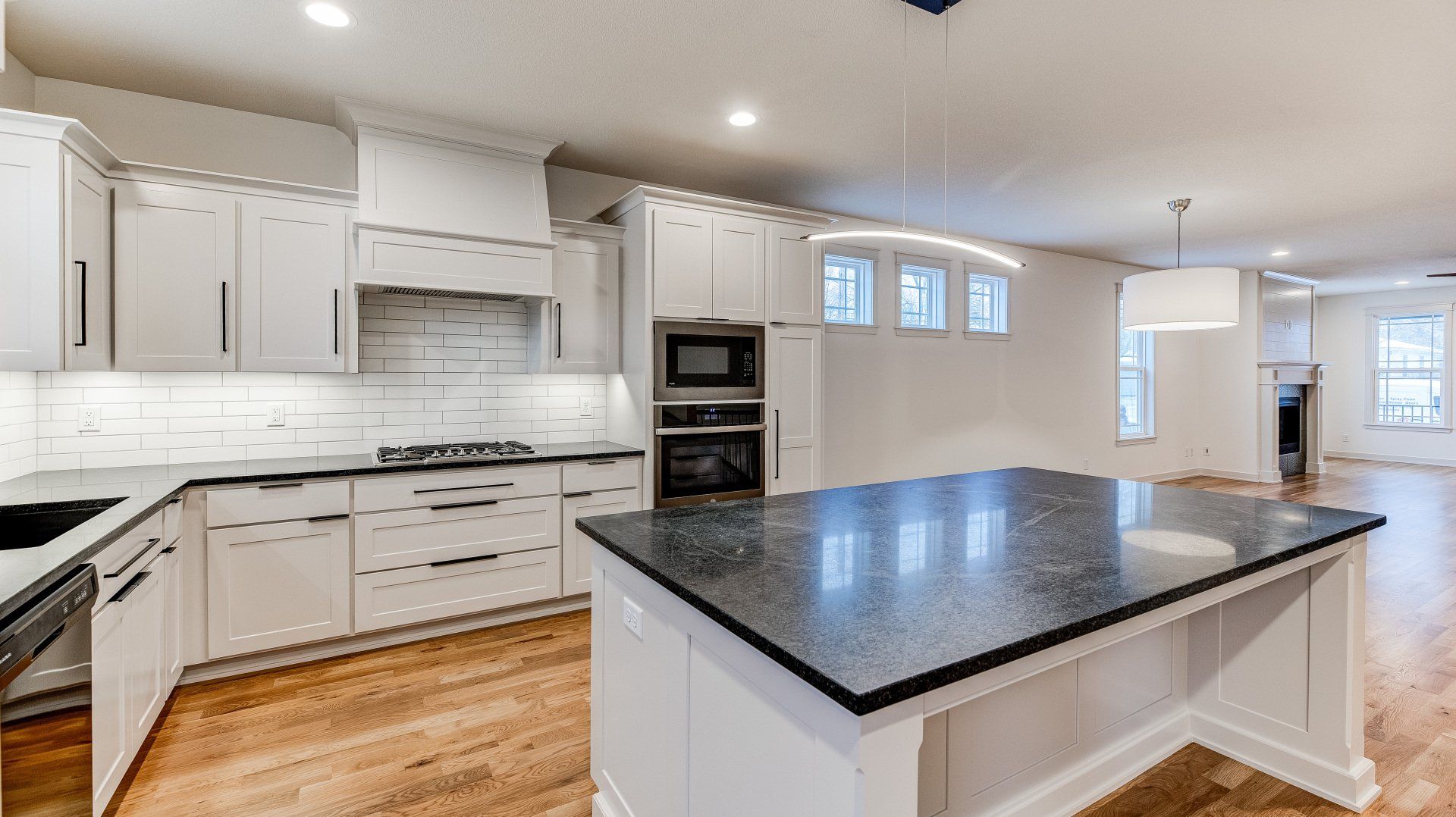 There is a large island in the middle of the kitchen.