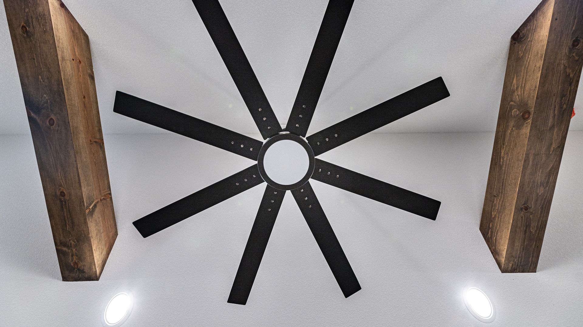 A ceiling fan with a hole in the middle of it