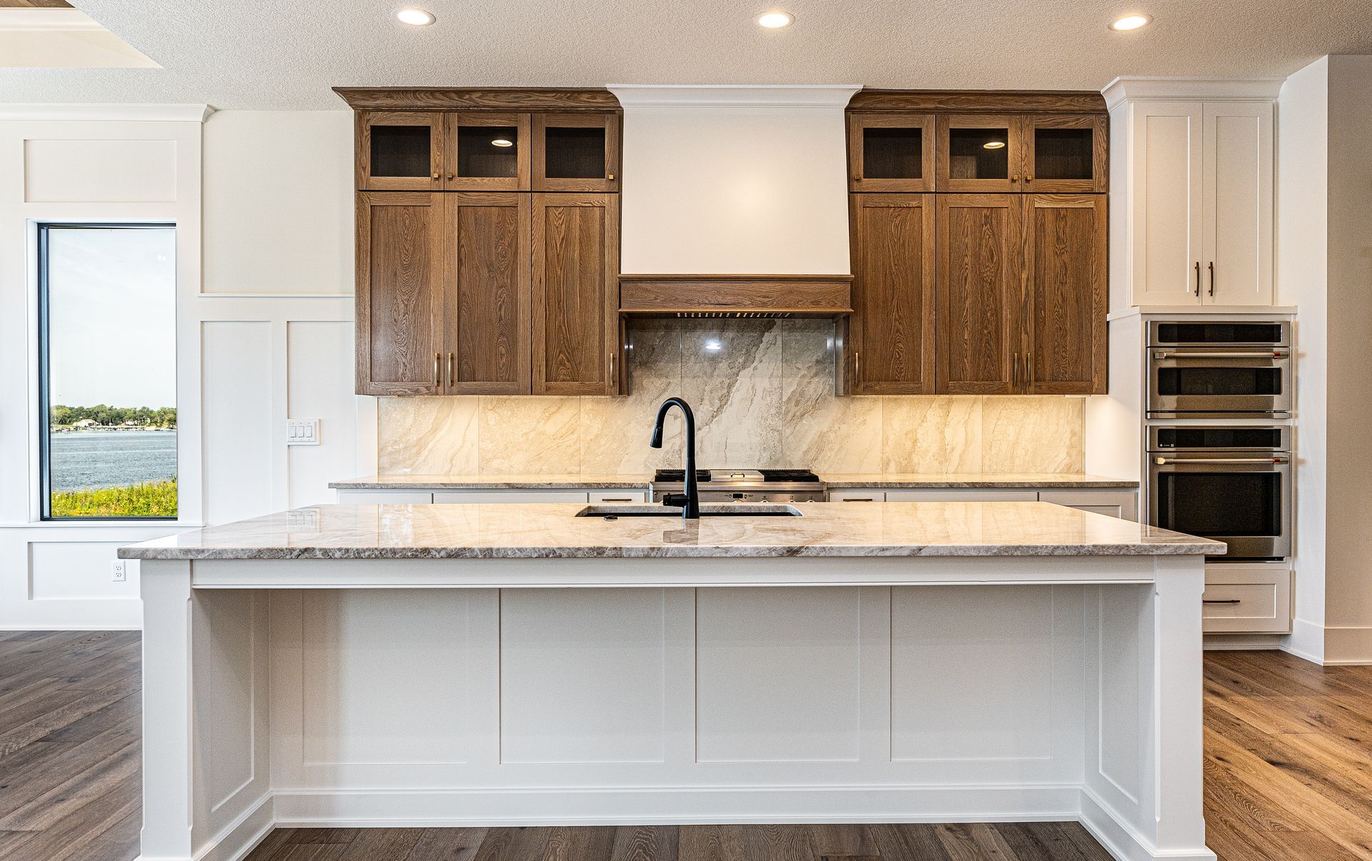 There is a large island in the middle of the kitchen.