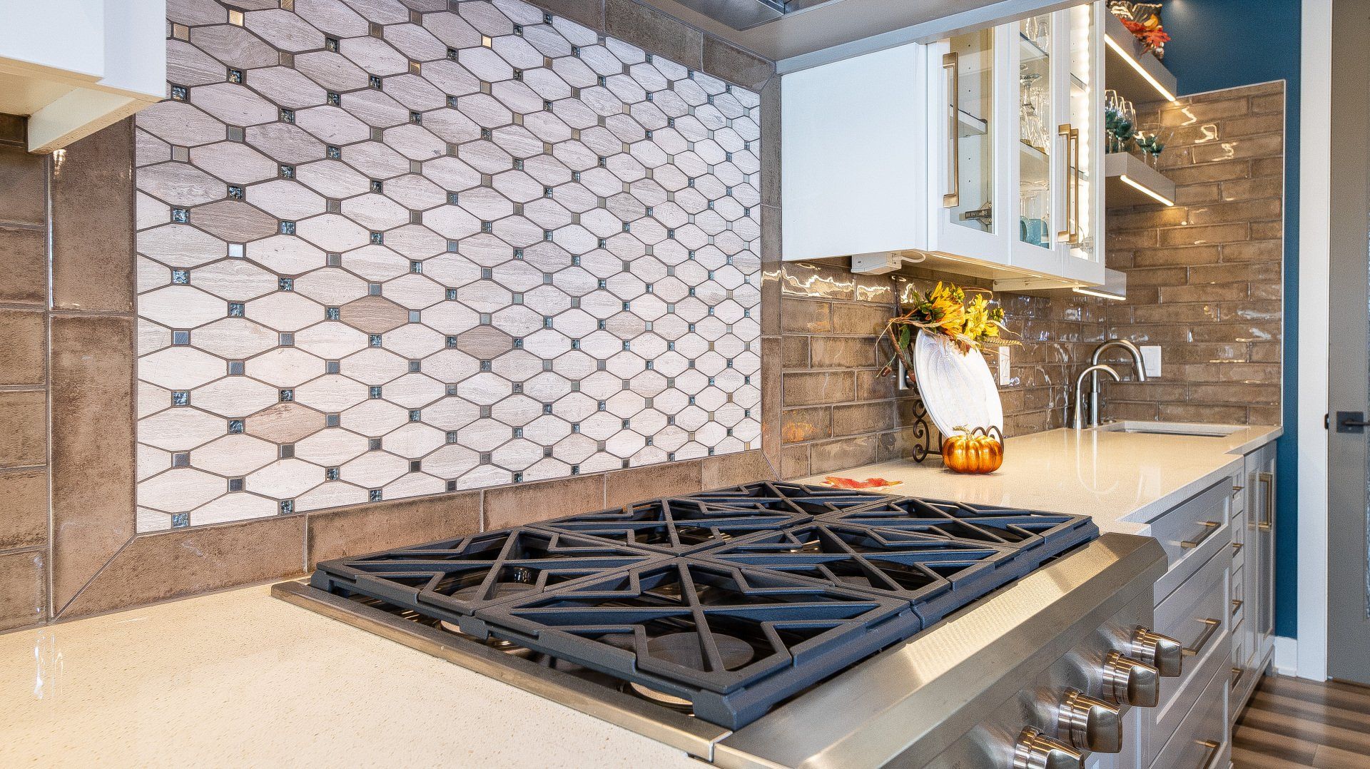 A stove top oven is sitting on top of a counter in a kitchen.