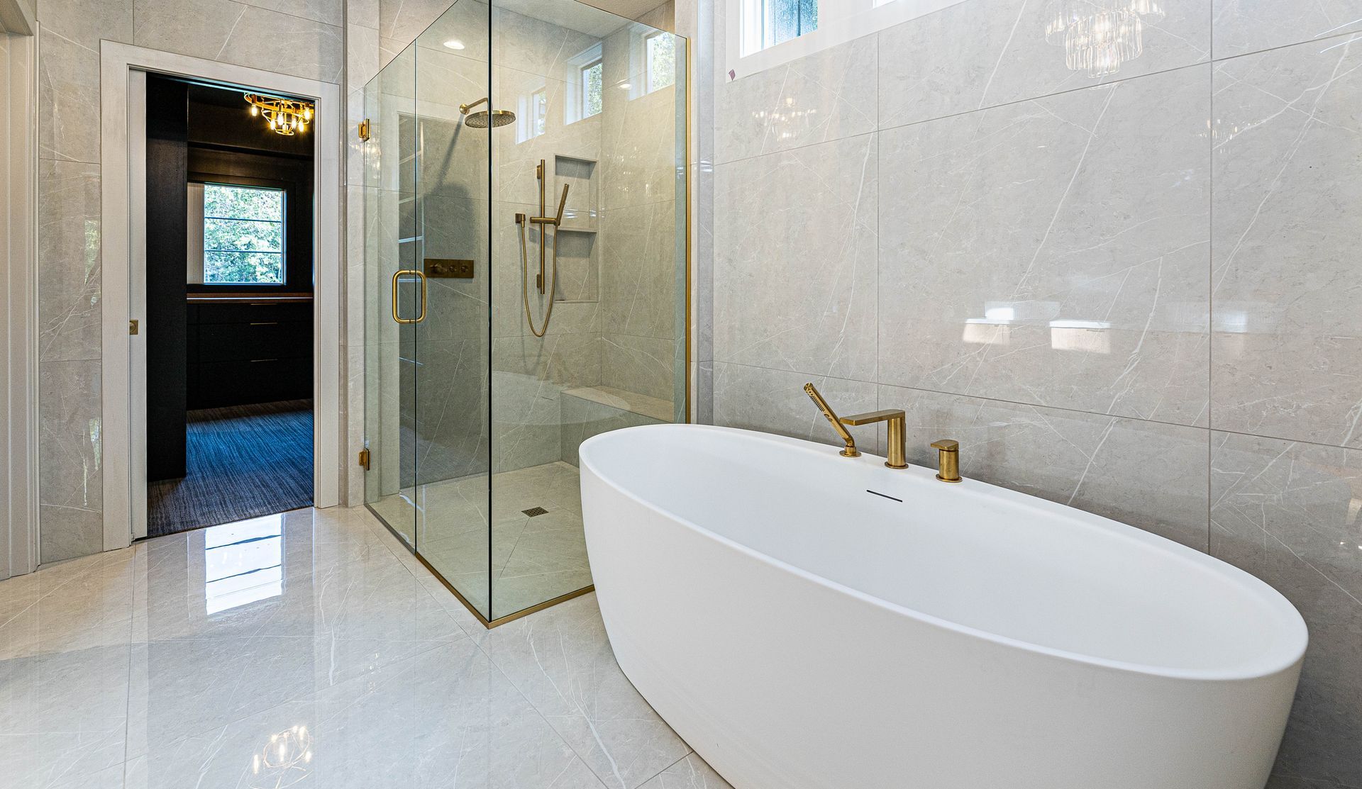 A bathroom with a bathtub and a walk in shower.
