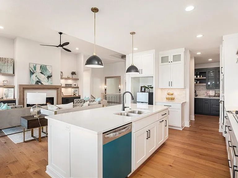 There is a large island in the middle of the kitchen.