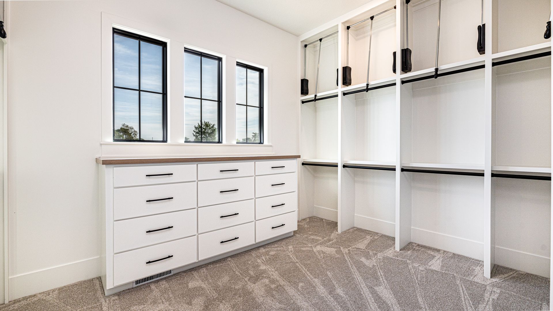 It is a walk in closet with lots of shelves and drawers.