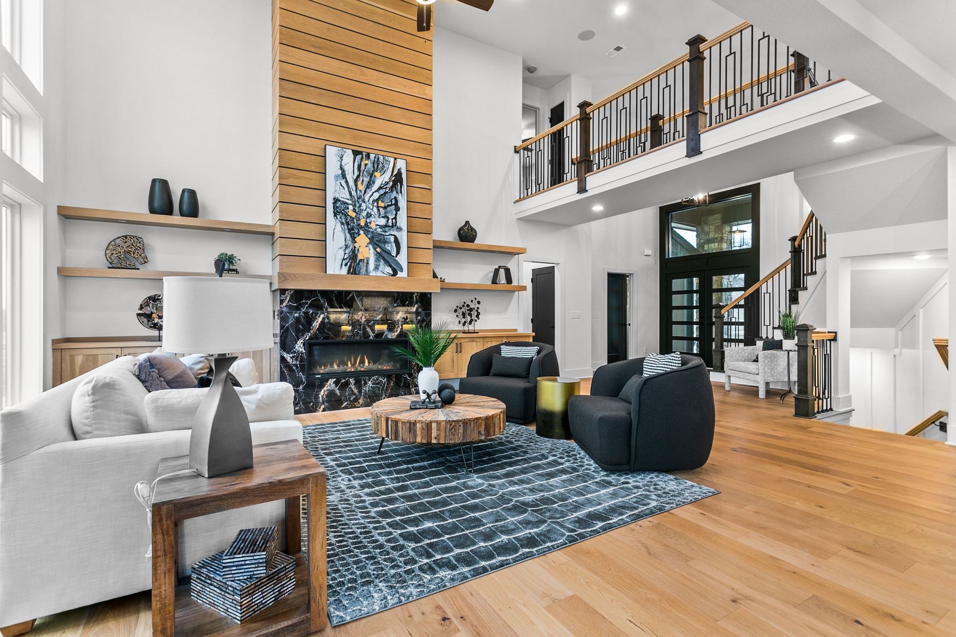 A living room filled with furniture and a fireplace.