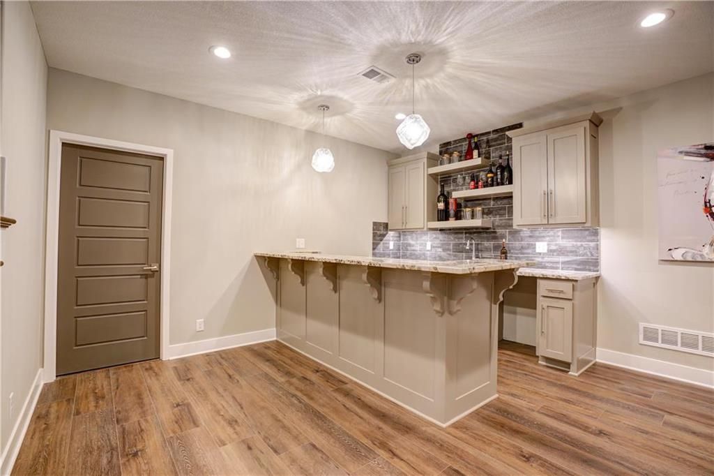 There is a bar in the middle of the room.