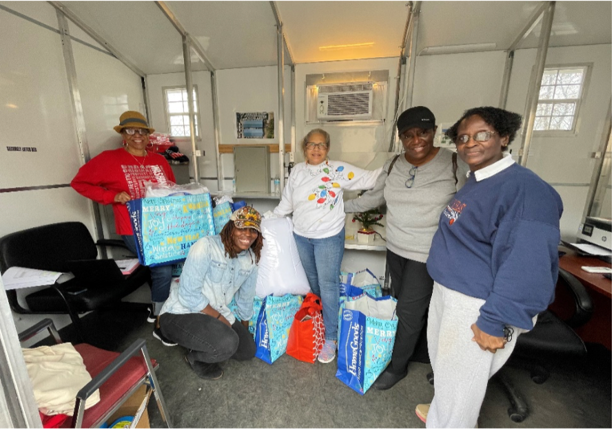 DOK members donating to RAPID SHELTER- for the “Homeless.”