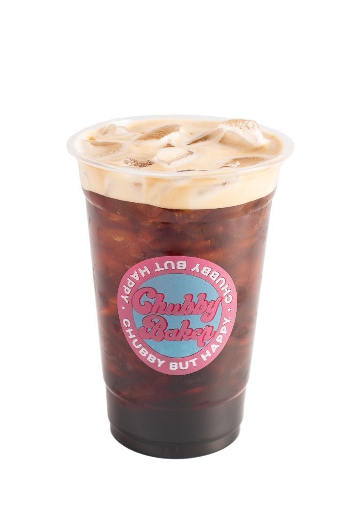 Iced coffee in a plastic cup with a pink logo that says 