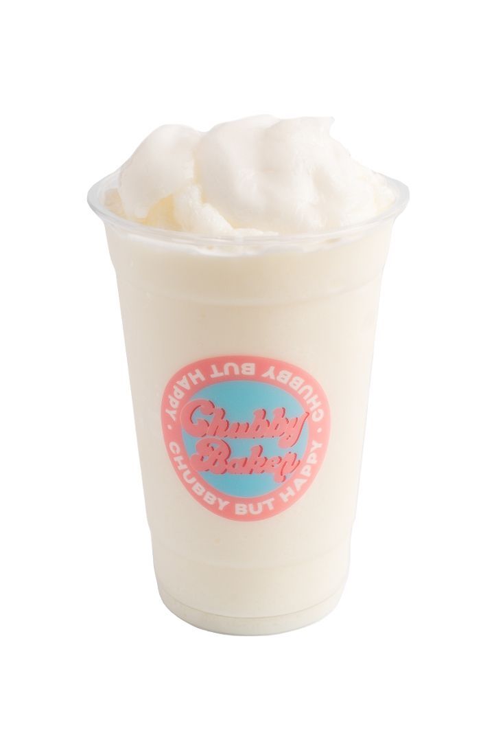 A white, frothy beverage in a clear plastic cup with a pink and blue logo.