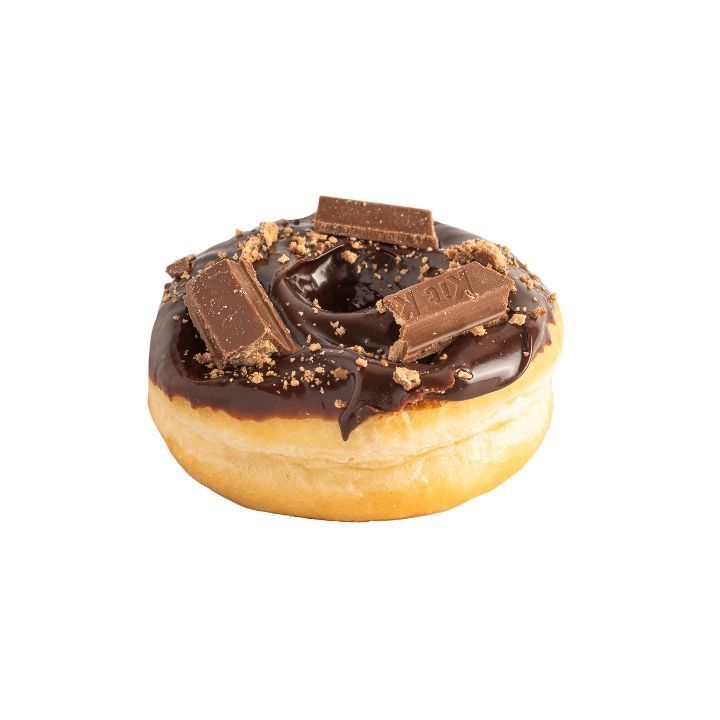 Chocolate frosted donut topped with chocolate pieces and sprinkles, against a white background.