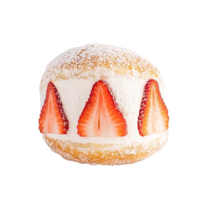 Doughnut with whipped cream filling and three sliced strawberries, dusted with powdered sugar.