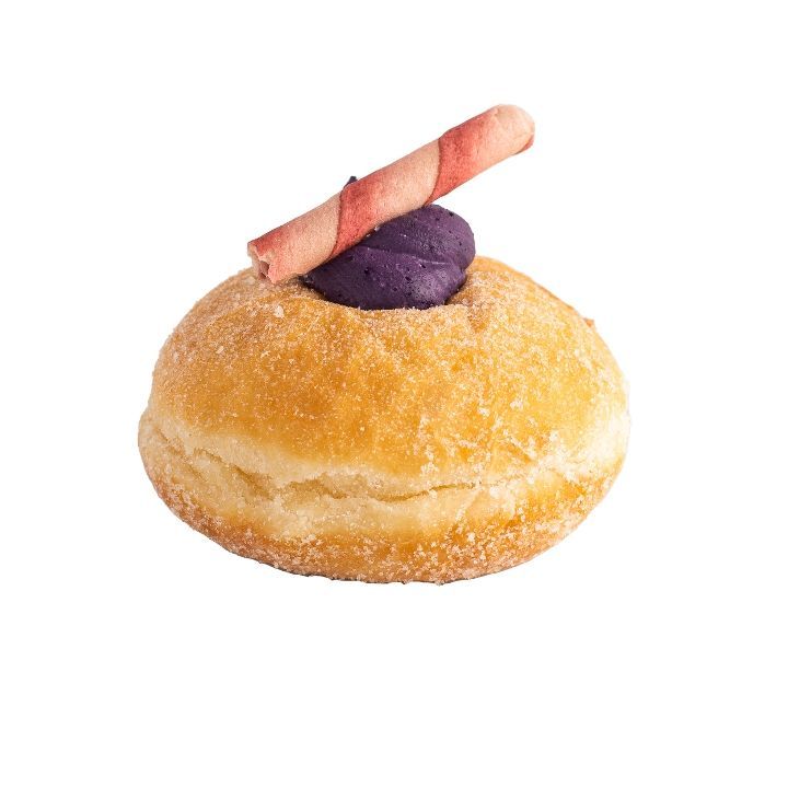 Donut with purple filling and a pink wafer stick on top. Sugar-coated, isolated on white.