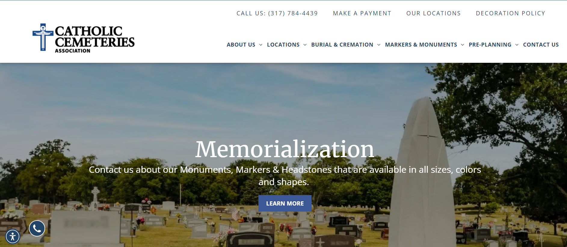 The website for catholic cemeteries shows a cemetery with a large white monument in the middle.