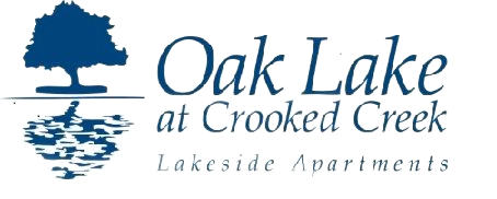 Logo for Oak Lake at Crooked Creek Lakeside Apartments, blue tree reflecting in blue water, white background.