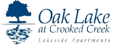 Logo for Oak Lake at Crooked Creek Lakeside Apartments, blue tree reflecting in blue water, white background.
