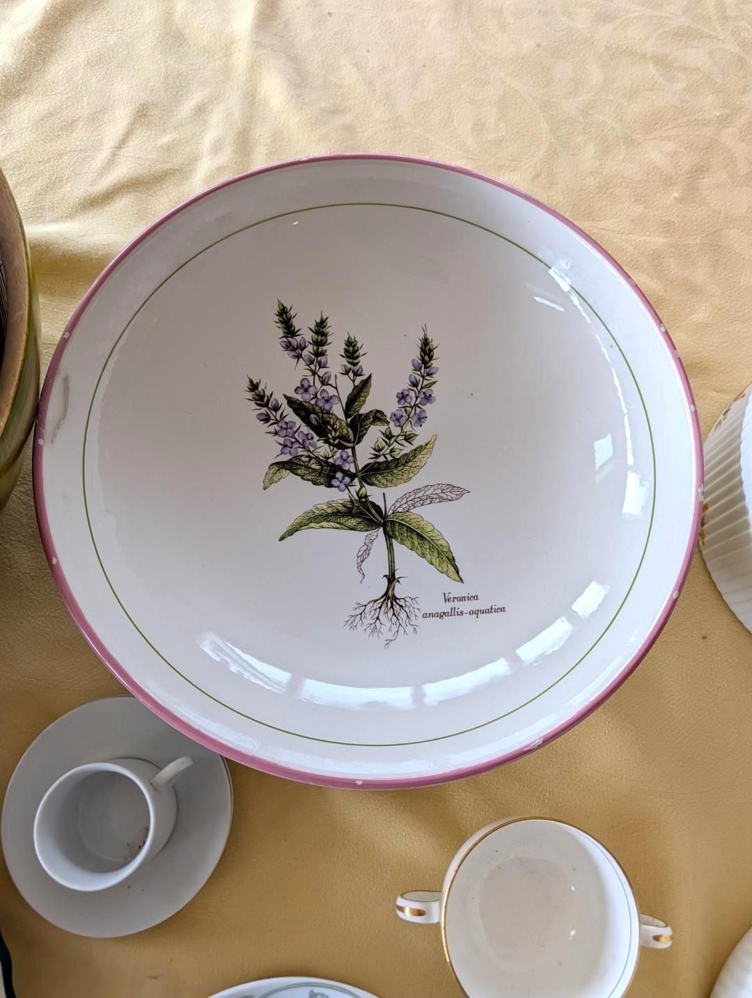A large white serving bowl with a purple floral illustration.