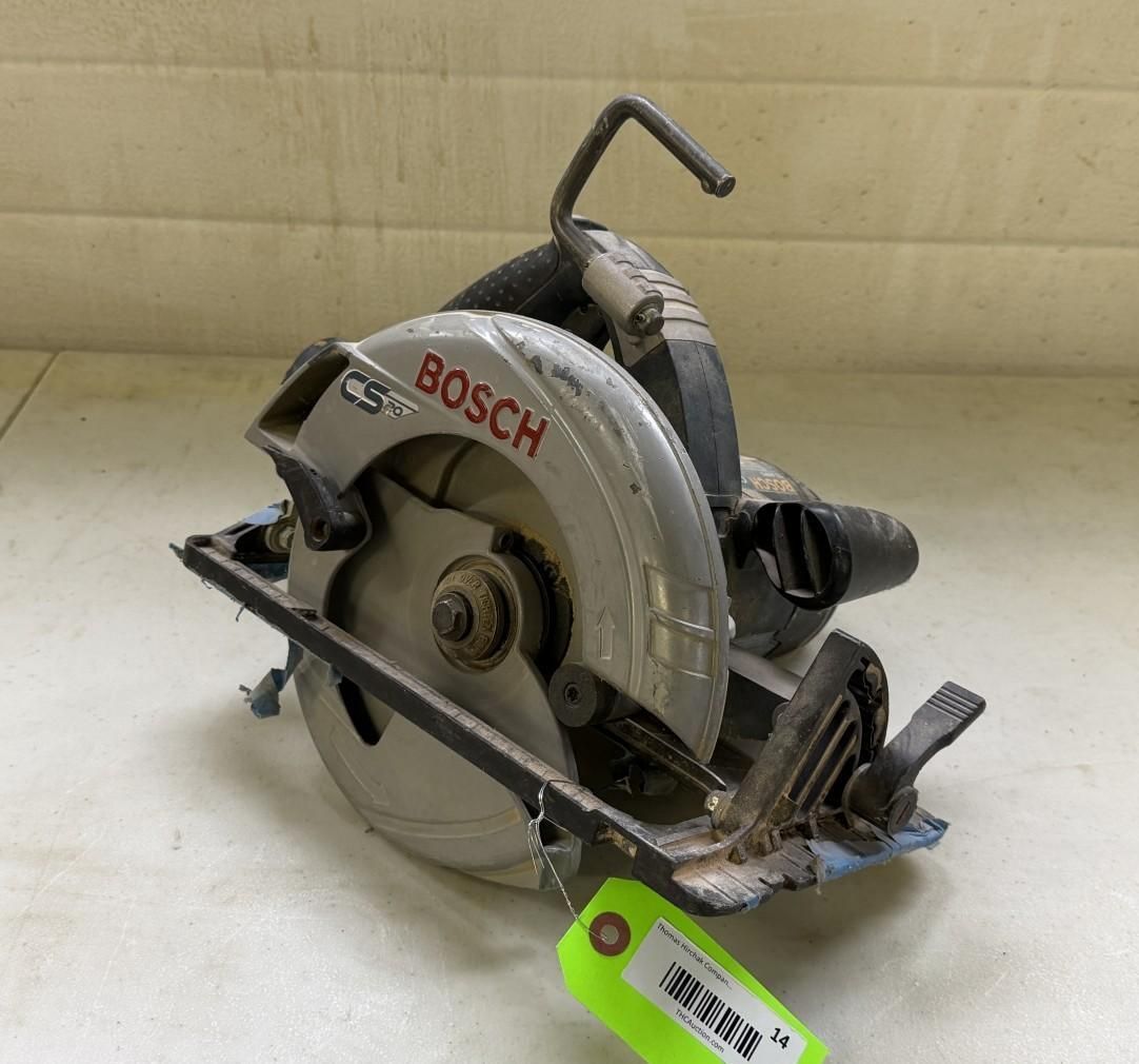 Bosch circular saw on a white surface with a green tag attached.