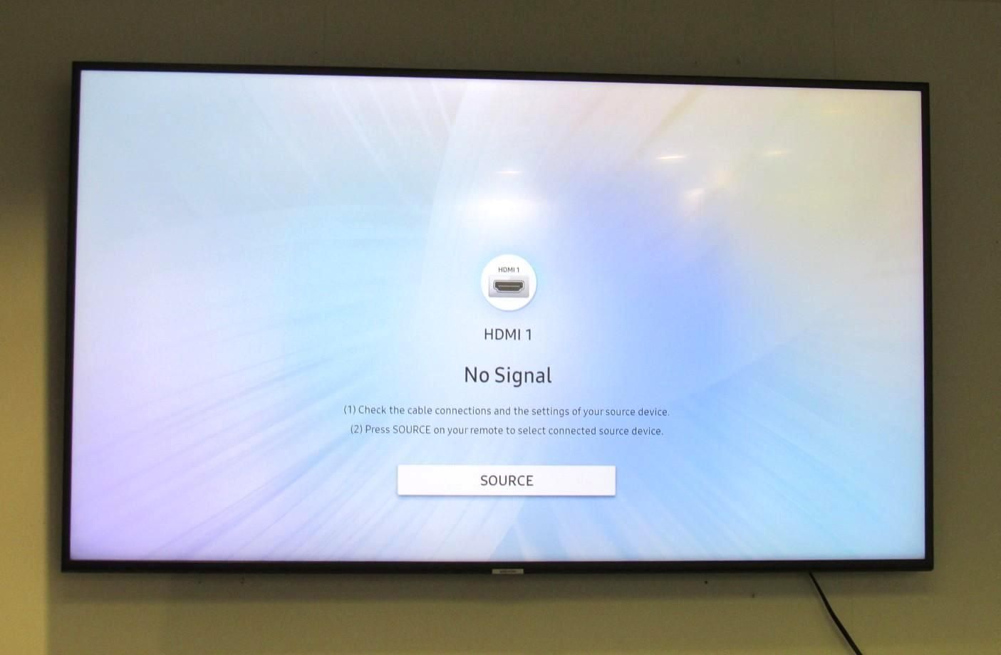 Large TV screen showing a white loading screen.