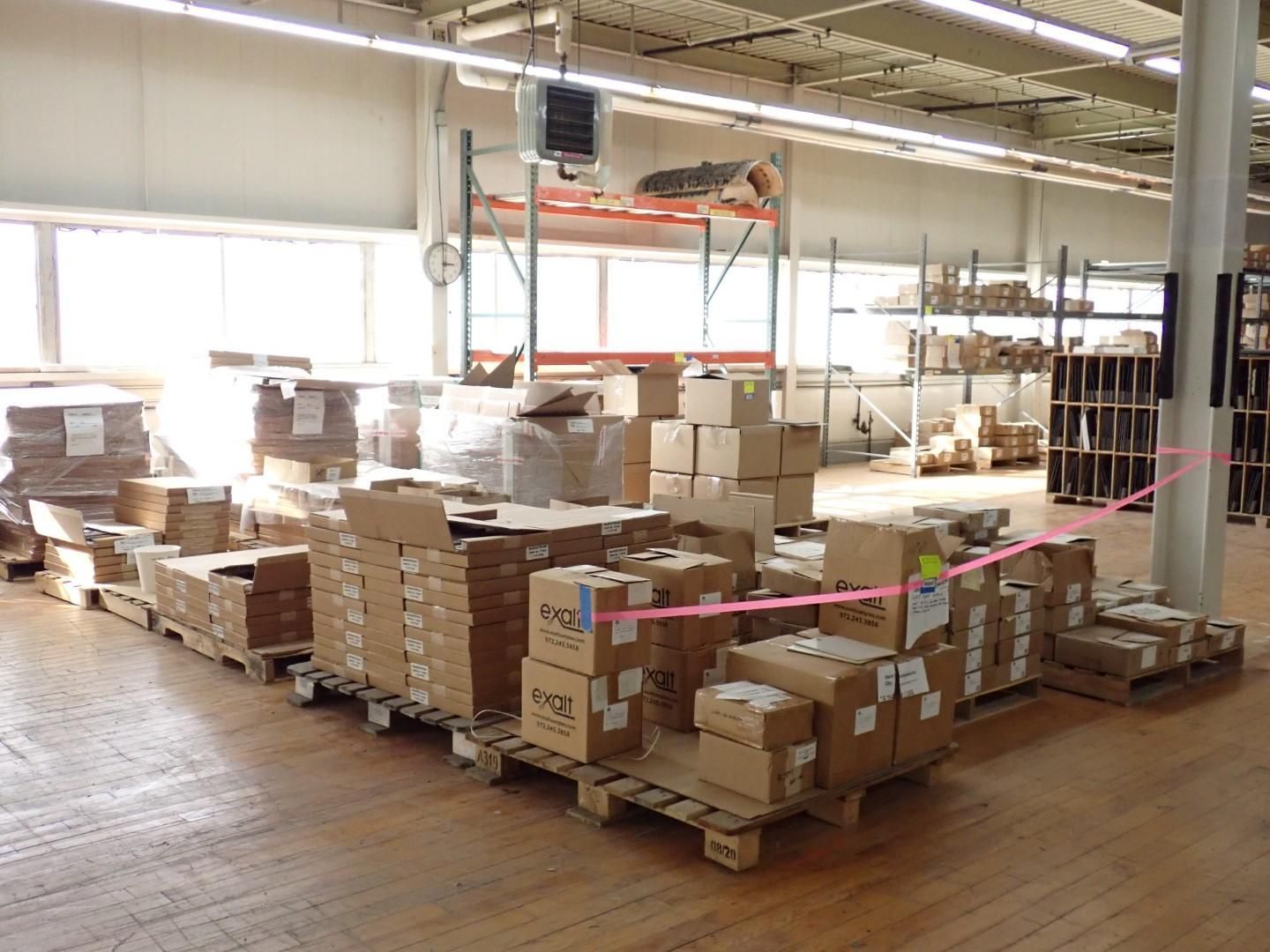 Warehouse with cardboard boxes stacked on pallets.