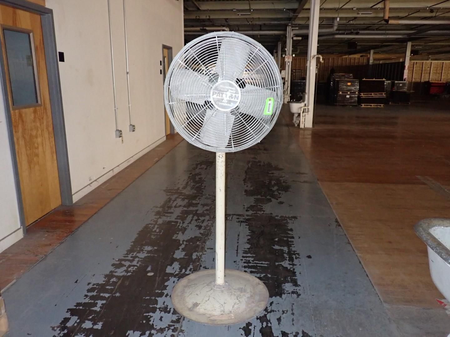 Large industrial fan on a stand.