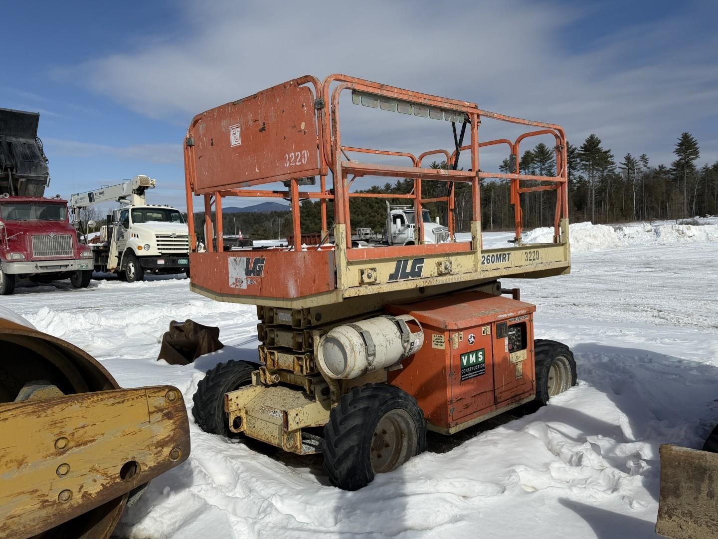Orange JLG lift on wheels.