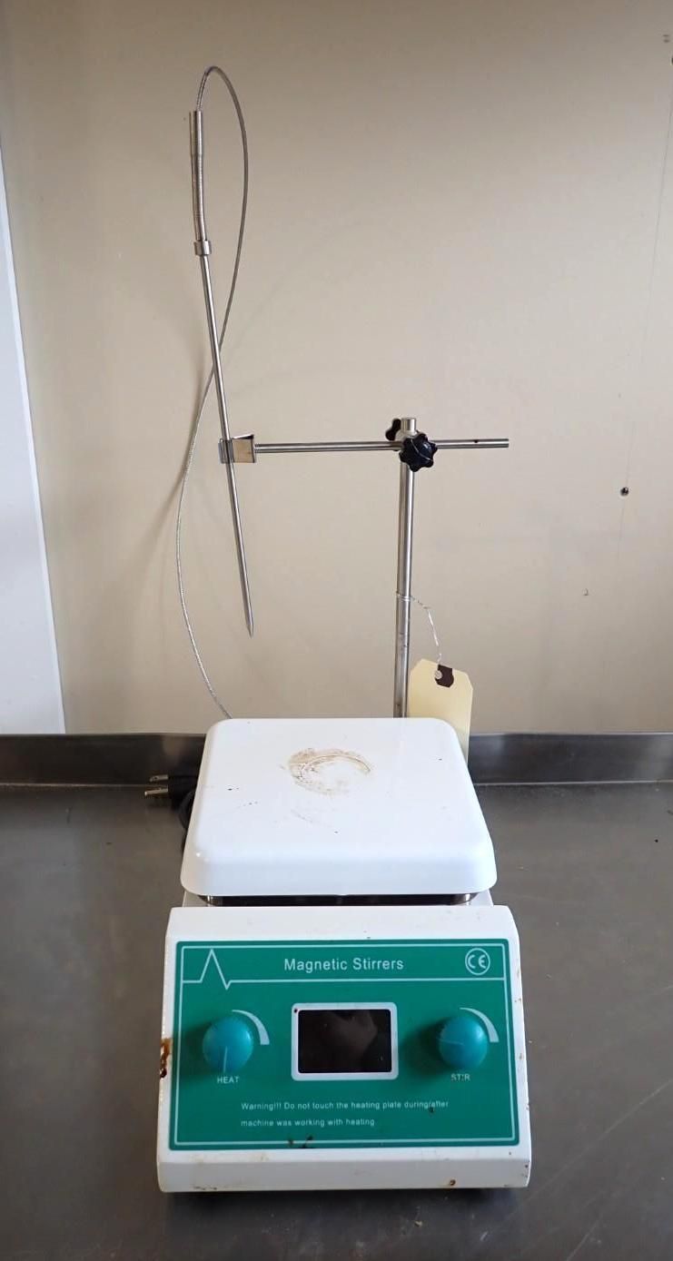 Magnetic hot plate stirrer with a temperature probe attached to a stand on a lab counter.