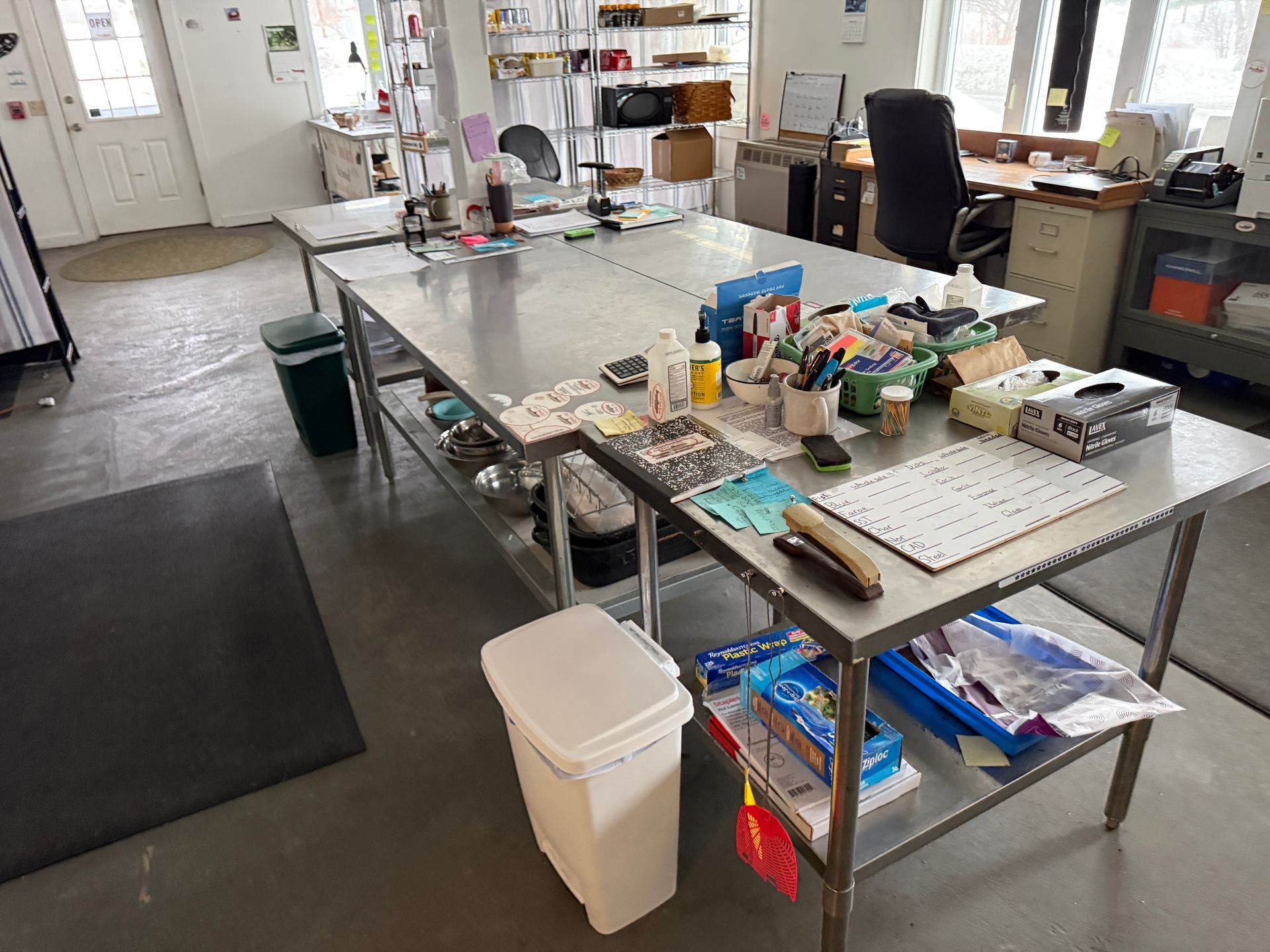 Bright workshop with long metal tables